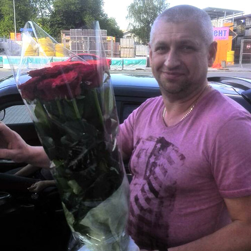 букет червоних троянд для чоловіка фото